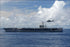 24"x36" Gallery Poster, An HH-60H Seahawk helicopter flies past the Nimitz-class aircraft carrier USS Nimitz