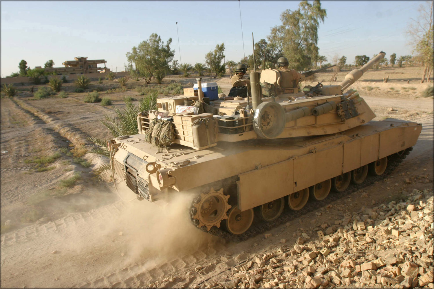 24"x36" Gallery Poster, An M-1A1 Abrams tank kicks up dust as it moves into position during a mortar attack in Fallujah, Iraq, on Aug. 14,