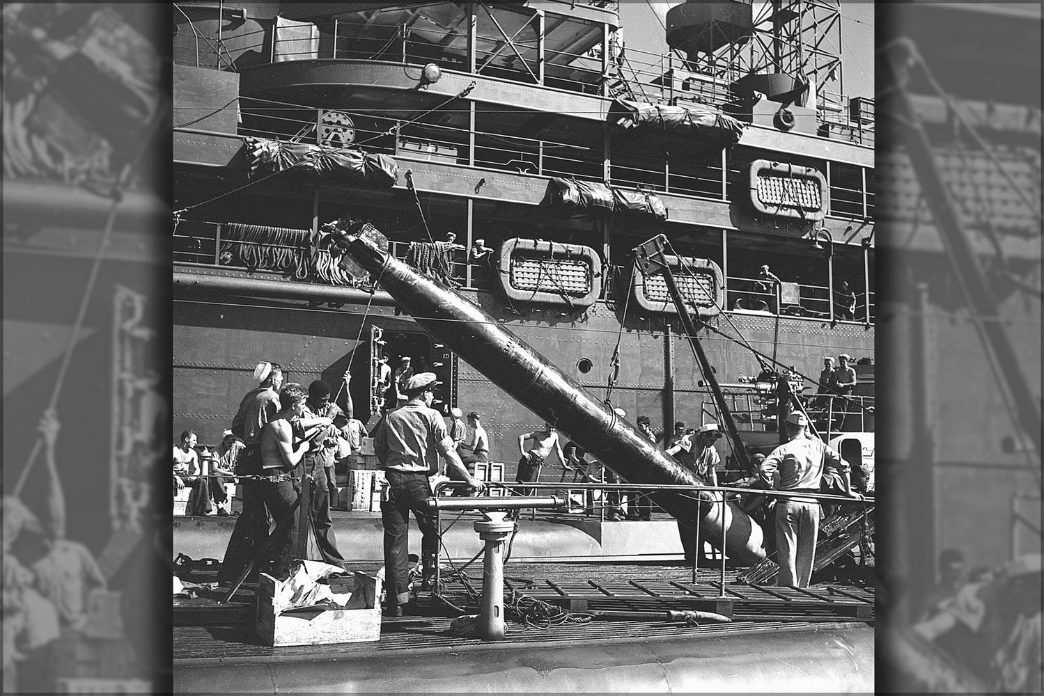 24"x36" Gallery Poster, Crewmen transferring a torpedo from a submarine tender to a submarine about to leave on war patrol. 1945