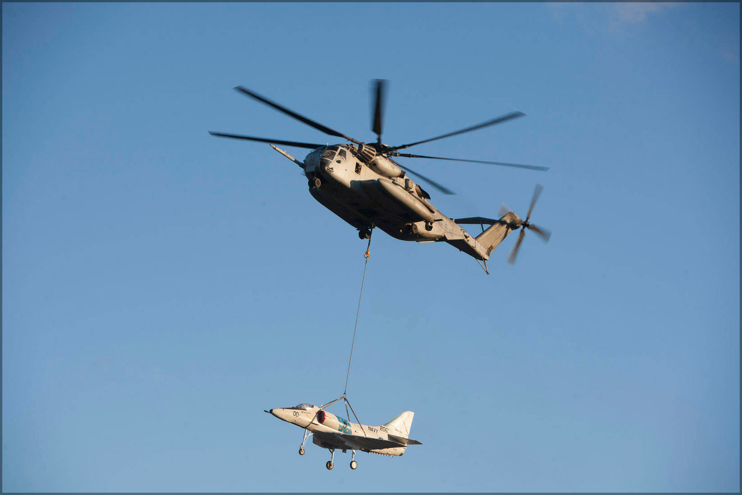 Poster, Many Sizes Available; Ch-53E Super Stallion Helicopter Transports An A-4 Skyhawk