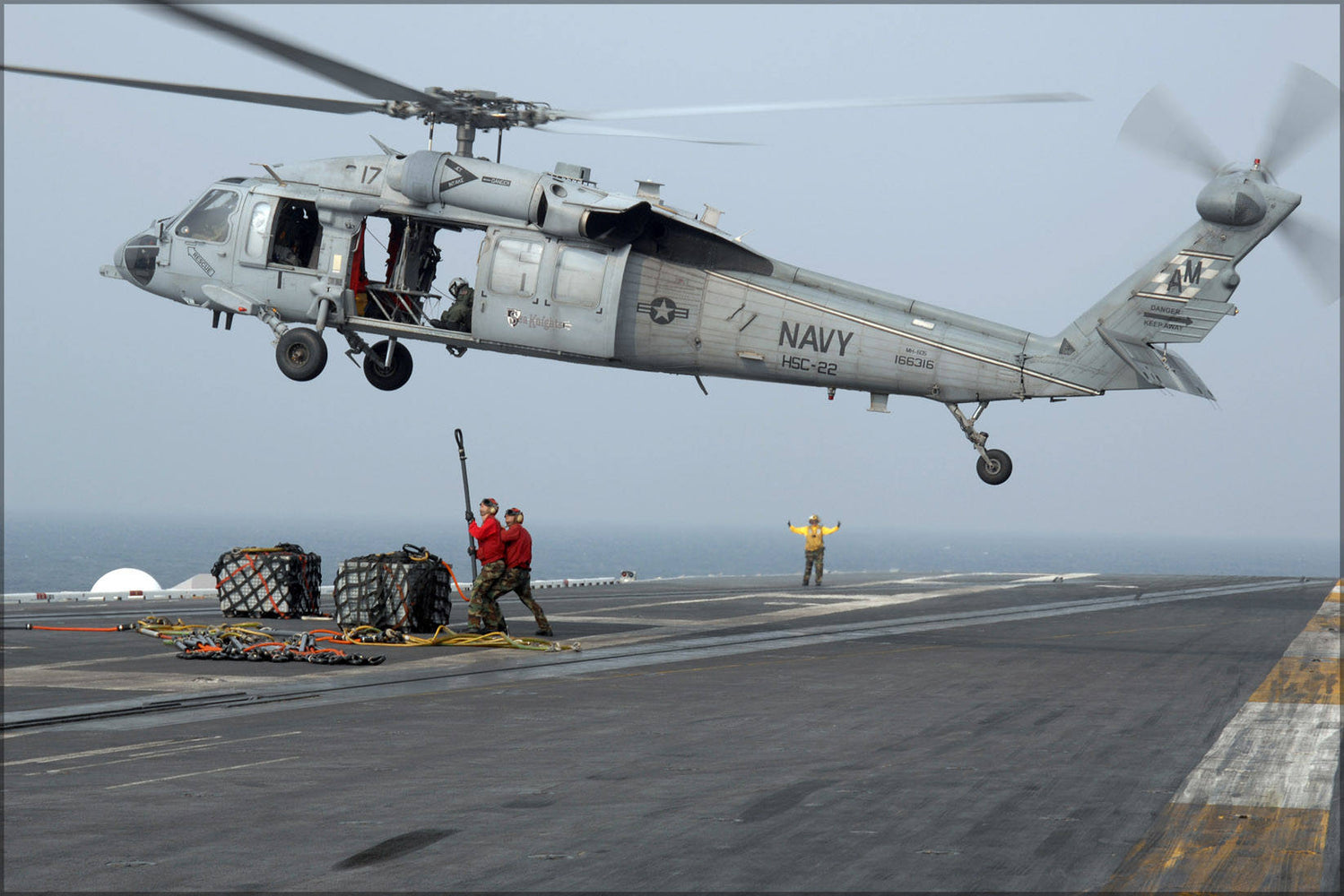 Poster, Many Sizes Available; Mh-60S Seahawk Assigned To The Sea Knights Aircraft Carrier Uss Theodore Roosevelt (Cvn 71) Attach Ammunition