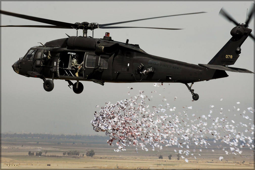 Poster, Many Sizes Available; Uh-60 Black Hawk Helicopter Drops Leaflets 350Th Tactical Psychological Operations, 10Th Mountain Division, Dr